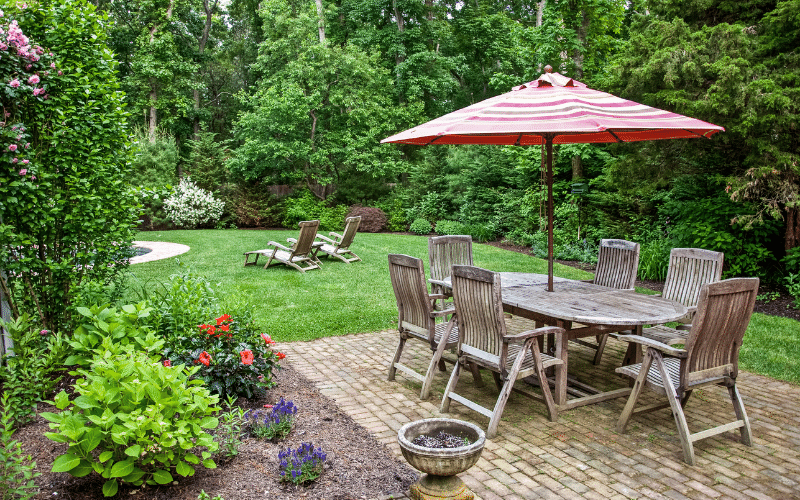 backyard oasis with wood furniture